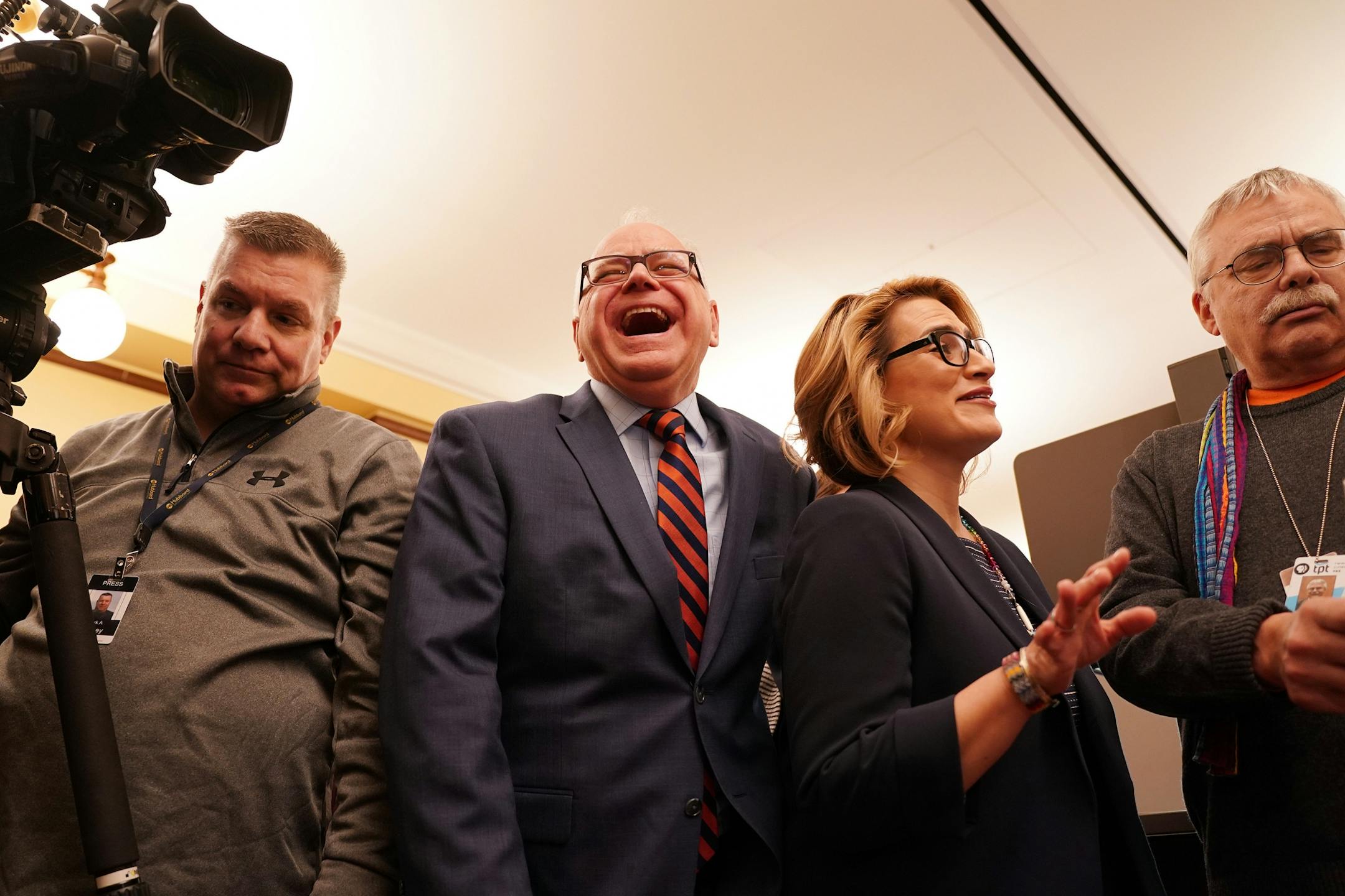 Gov.-elect Tim Walz and Lt. Gov.-elect Peggy Flanagan talked with reporters as they arrived for a press conference at their transition offices in the State Capitol Thursday morning.