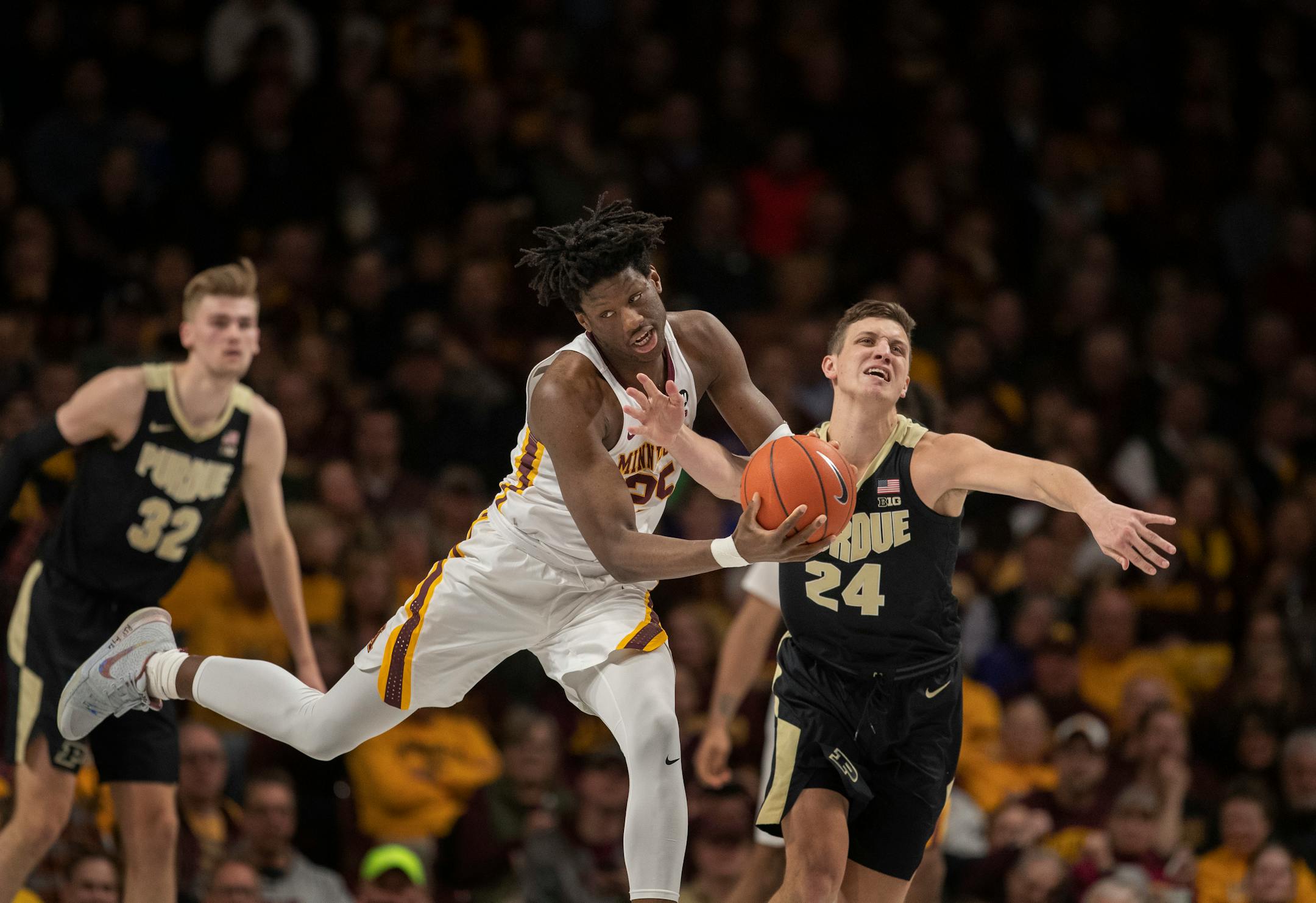 Purdue forward Grady Eifert (24) forced a turnover on Gophers center Daniel Oturu on March 5.