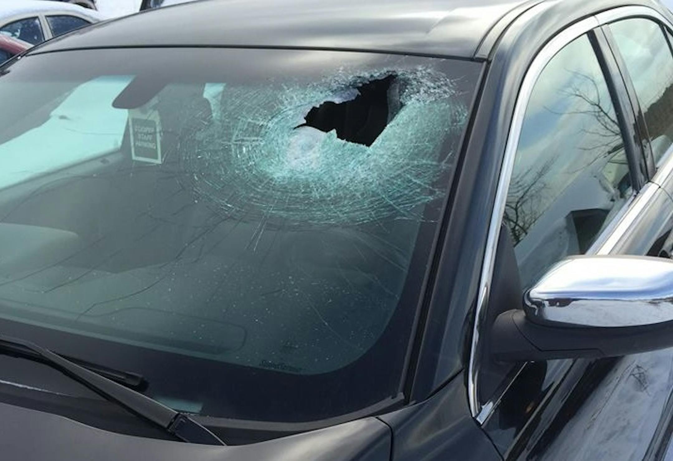 The Minnesota State Patrol is looking for the public's help locating a person who tossed a large rock off an overpass in Duluth on Sunday evening.