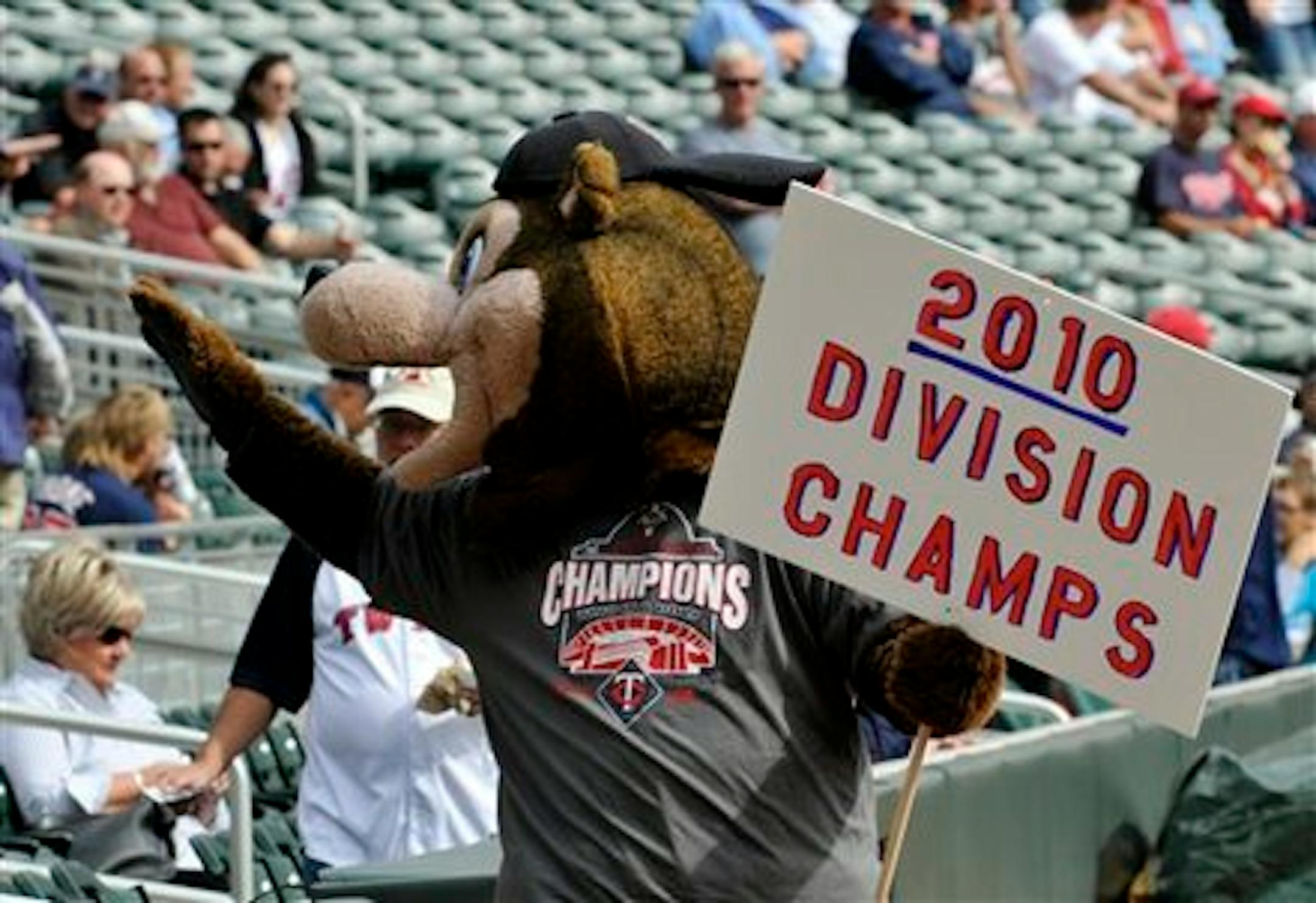 TC, the Minnesota Twins mascot, carrys a champions sign prior to the baseball game against the Cleveland Indians Wednesday, Sept. 22, 2010,  in Minneapolis.  The Twins won the American League Central Division Tuesday night with a win over the Indians and a White Sox loss to the Athletics. (AP Photo/Jim Mone)