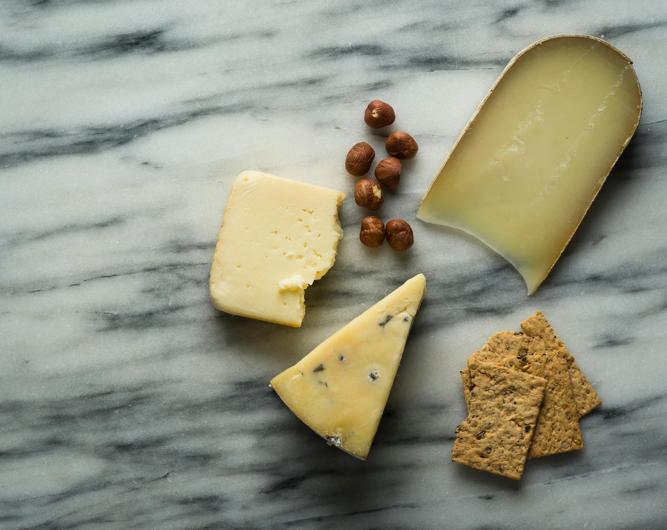 From top right clockwise, Shepherd's Way Friesago, Dunbarth Blue and Widmer's Brick Cheese. ] AARON LAVINSKY • aaron.lavinsky@startribune.com Cheese plate photos taken Monday, November 3, 2014 in the Star Tribune's Studio.