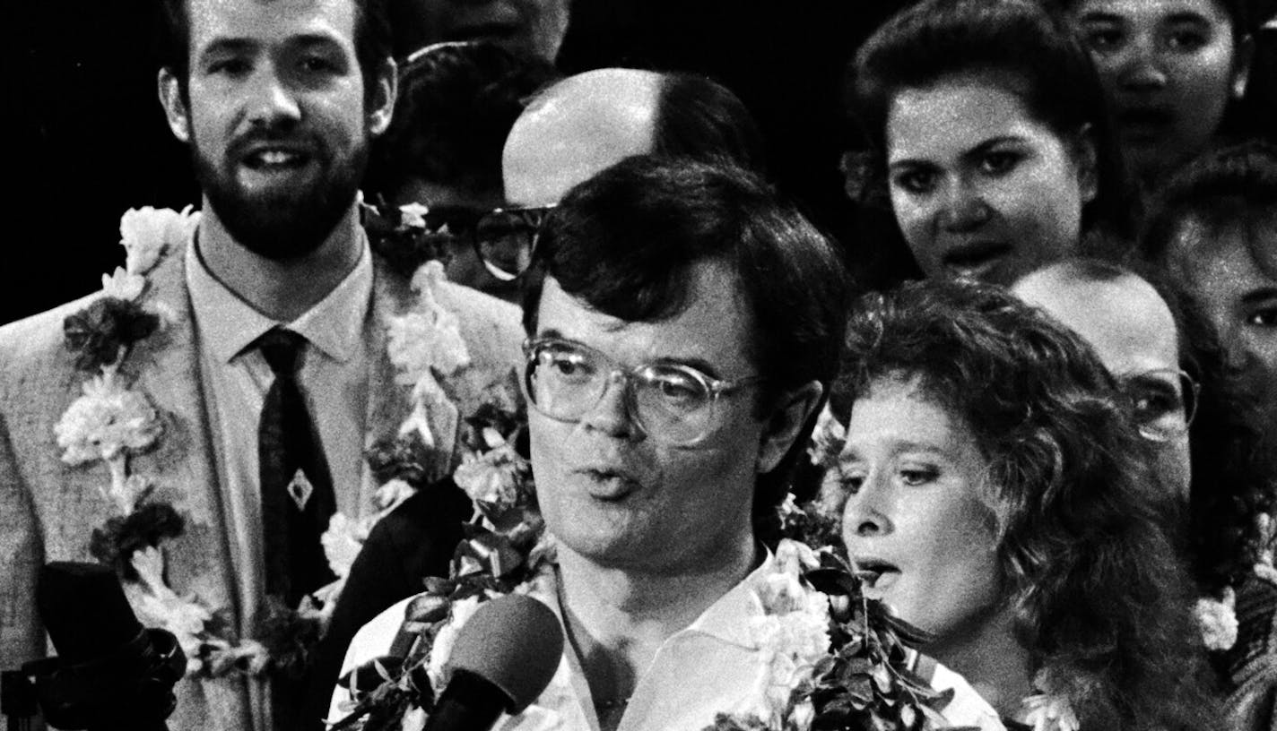 Dan Rowles joined Prairie Home Companion in 1985 as a stage hand and soon worked himself into a spot on the cast, where the budding comic performed in some of the show&#x2019;s most beloved recurring skits. He later became the show&#x2019;s director. Here he is at left (in lei and tie, and beard) standing behind Garrison Keillor.