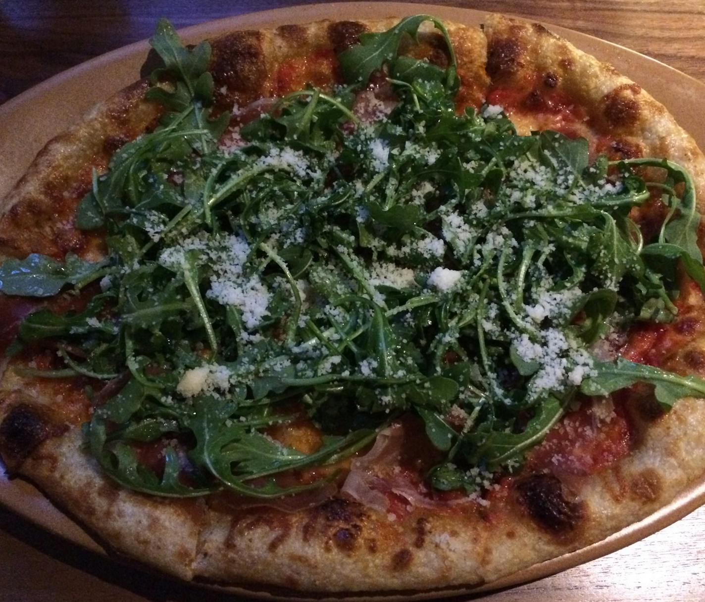 Scena Tavern's ham-arugula pizza.