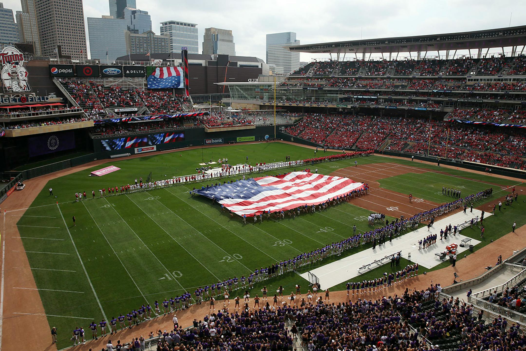 Fans watched as a giant American fly was unfurled on the field in preparation for the National Anthem Saturday.