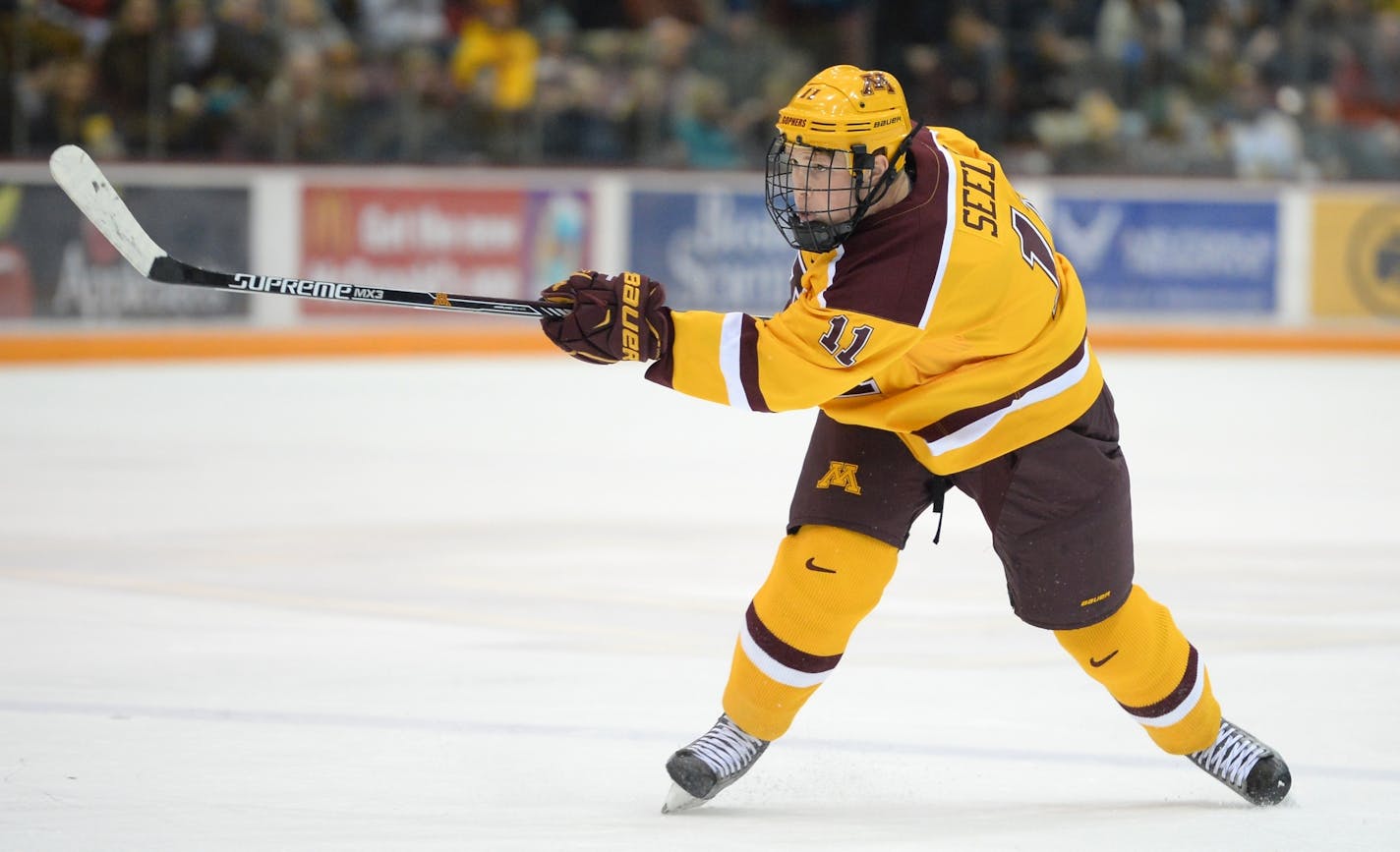 Minnesota Golden Gophers defenseman Nick Seeler (11) took a shot against the Michigan State Spartans in the second period.