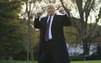President Donald Trump gestures as he walks to Marine One after speaking to media at the White House in Washington, Tuesday, Nov. 20, 2018, for the sh