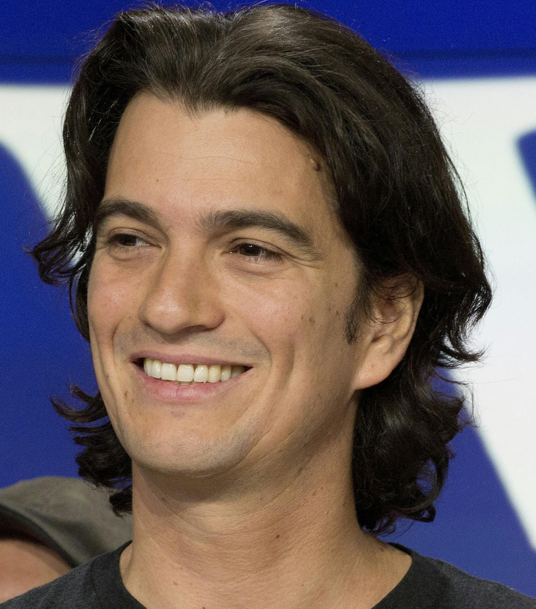 FILE - In this Jan. 16, 2018 file photo, Adam Neumann, co-founder and CEO of WeWork, attends the opening bell ceremony at Nasdaq, in New York. The Wall Street Journal, citing sources it did not identify, reported Tuesday, Oct. 22, 2019, Neumann will walk away with close to $2 billion from Japan&#x2019;s SoftBank Group if he severs ties with the company. (AP Photo/Mark Lennihan, File)