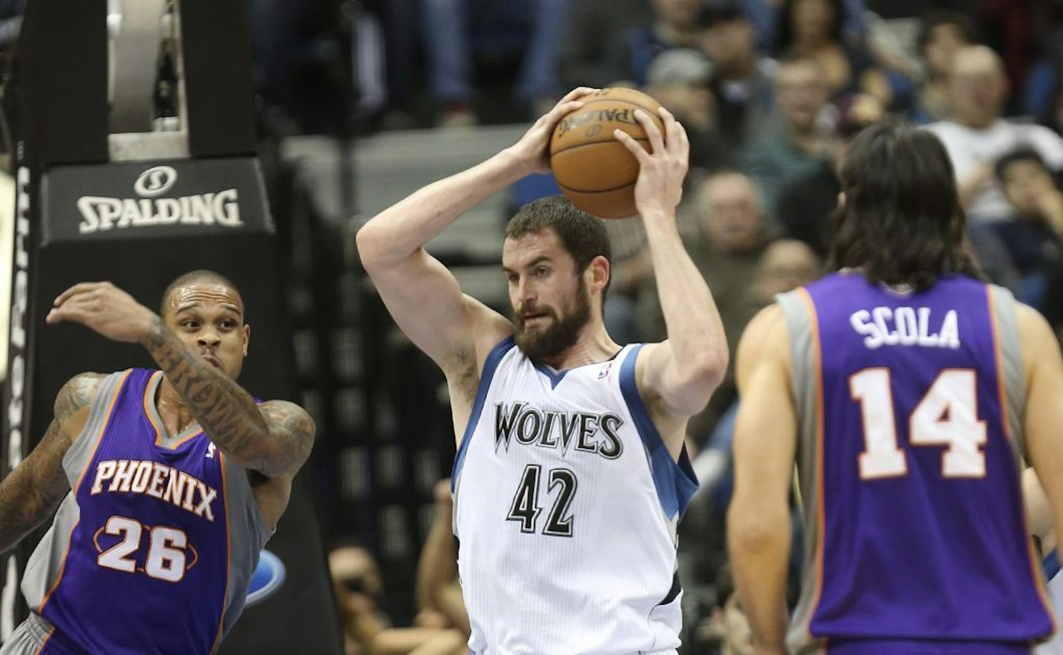Timberwolves Kevin Love pulled down a defensive rebound against Phoenix during the first half at the Target Center in Minneapolis, Min., Saturday December 29, 2012.