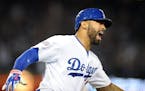 The Los Angeles Dodgers' Matt Kemp hits the go-ahead home run in the eighth inning against the St. Louis Cardinals during Game 2 of the National Leagu