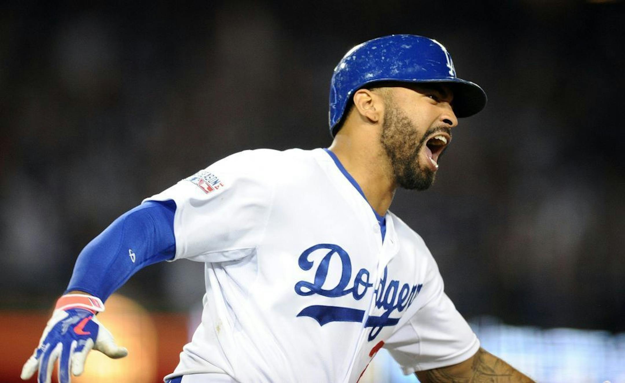 The Los Angeles Dodgers' Matt Kemp hits the go-ahead home run in the eighth inning against the St. Louis Cardinals during Game 2 of the National League Division Series at Dodger Stadium in Los Angeles on Saturday, Oct. 4, 2014.