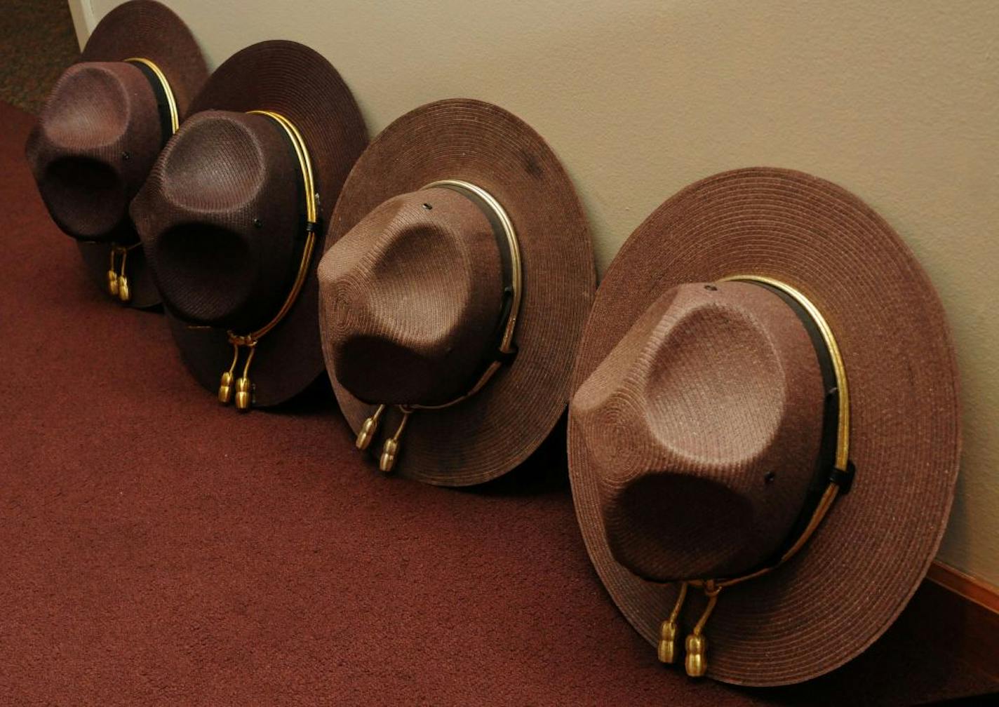 Troopers' hats rested against the wall during the ceremony in Eagan.