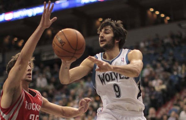 Ricky Rubio went airborne for a first-quarter pass against Houston on Monday night at Target Center. The rookie had 12 assists, but he also turned the