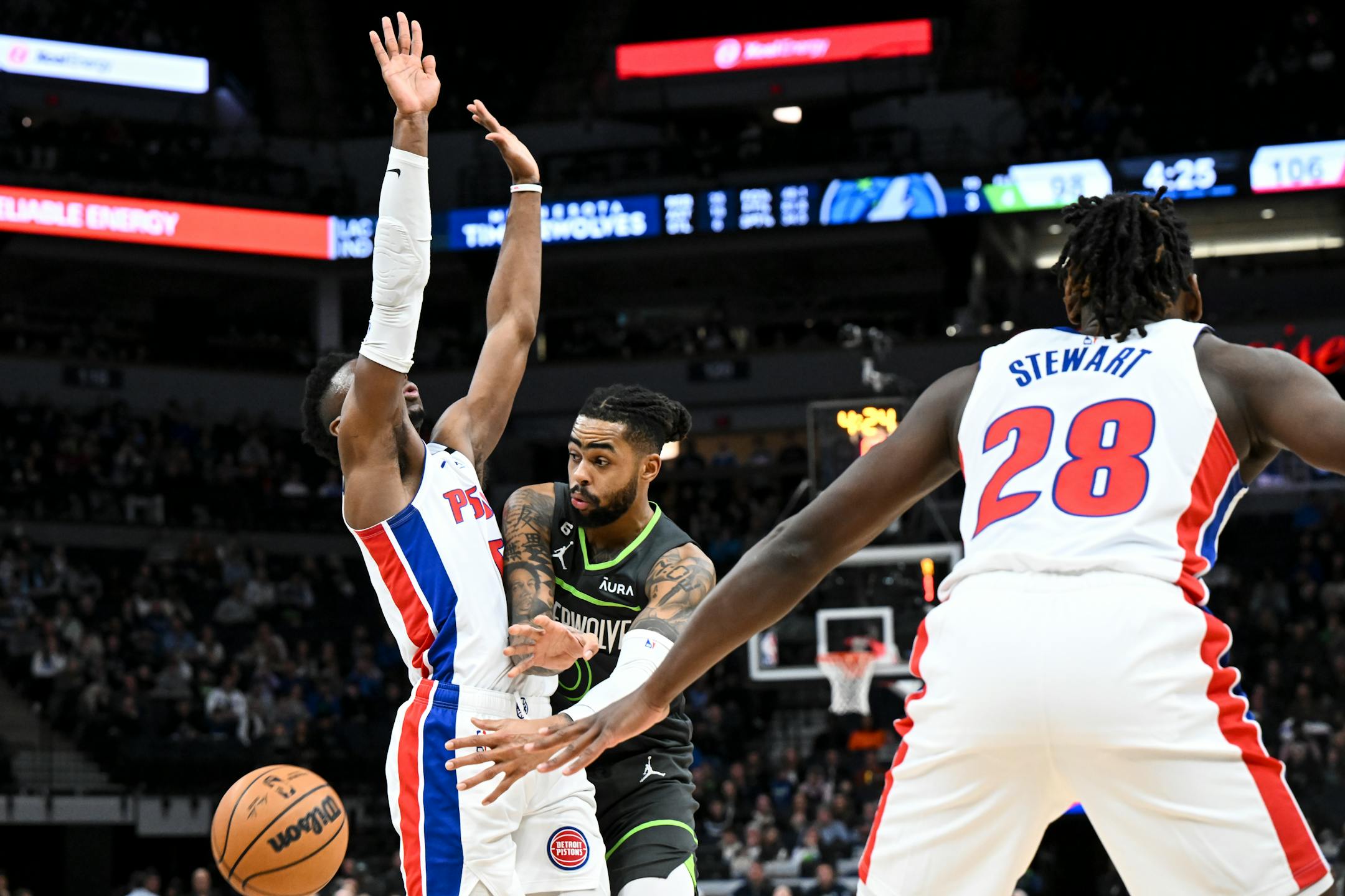 Minnesota Timberwolves guard D'Angelo Russell (0) passes the ball around Detroit Pistons guard Hamidou Diallo (6) during the second half.