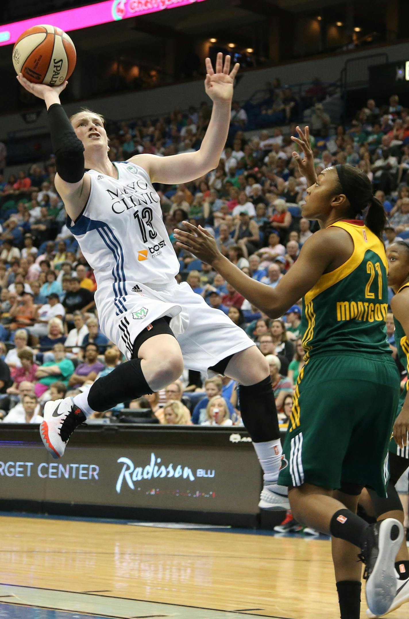 Lynx Lindsay Whalen went up for a basket after driving the lane passed Seattle defender Renee Montgomery during the first half. ] (KYNDELL HARKNESS/STAR TRIBUNE) kyndell.harkness@startribune.com Lynx vs Seattle at Target Center in Minneapolis, Min., Friday, July 3, 2015.