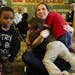 It's hugs for Alyssa Monas at the end of the music therapy session at Childhaven. These sessions are among the kids' favorite. (Alan Berner/Seattle Ti