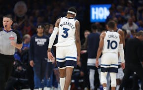 Minnesota Timberwolves forward Jaden McDaniels (3) walks off the court with the team after losing to the Oklahoma City Thunder on Thursday.