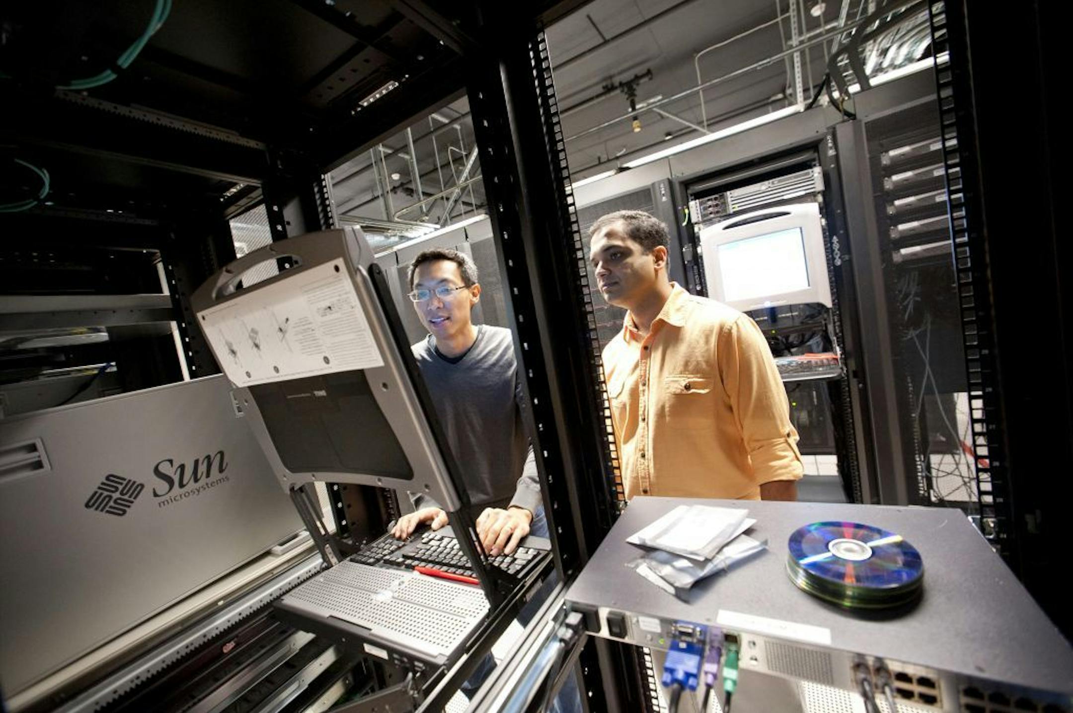 Security researchers Eric Chien, left, and Vikram Thakur at Symantec, where Chien has been tracking ransomware schemes, in Culver City, Calif., Nov. 21, 2012. Ransomware -- when a virus freezes a user's computer and criminals demand money to unlock it -- has become a lucrative online scheme.