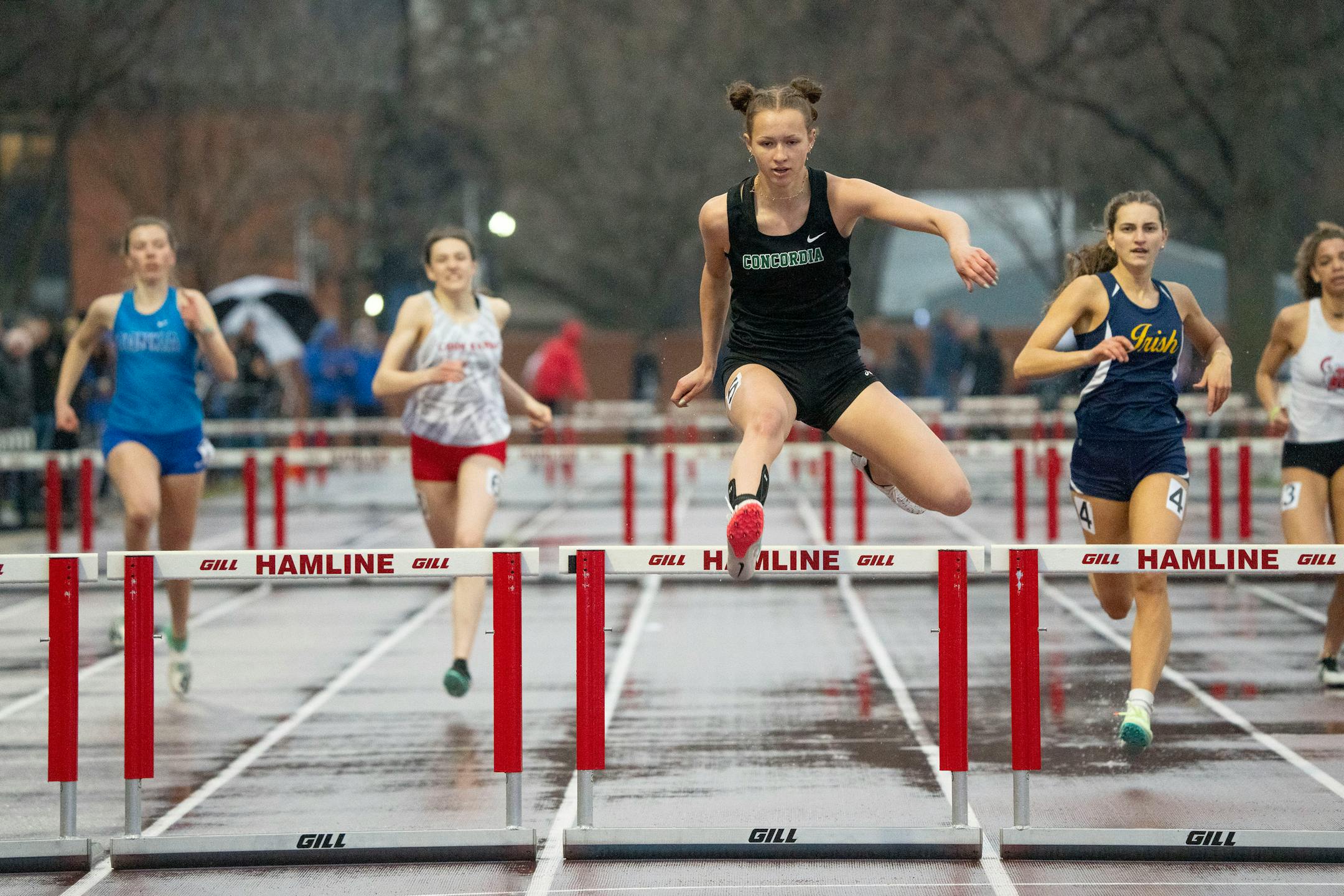Concordia Academy-Roseville hurdler Shaina Zinter clears the final hurdle of the girl's 300m hurdle event during the Hamline Elite Meet Friday, April 29, 2022 at Hamline University in St. Paul, Minn. Zinter placed first in the event. ]