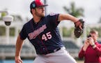 Twins to carry 12 pitchers, for now, with LaMarre's return