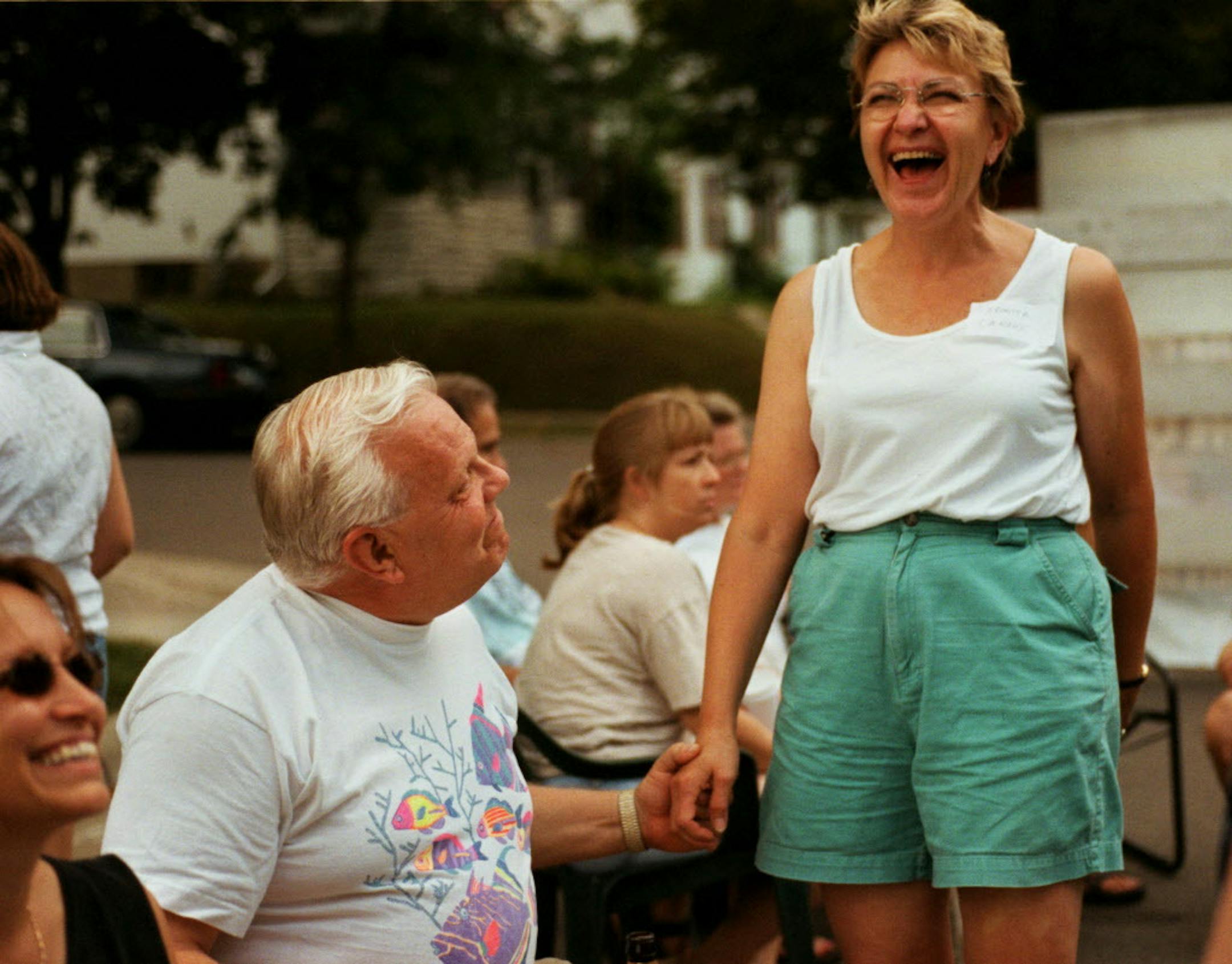 Longtime neighbors Denny Emerson and Veronica LaNoux shared a laugh at a block party in 2000 in St. Paul.