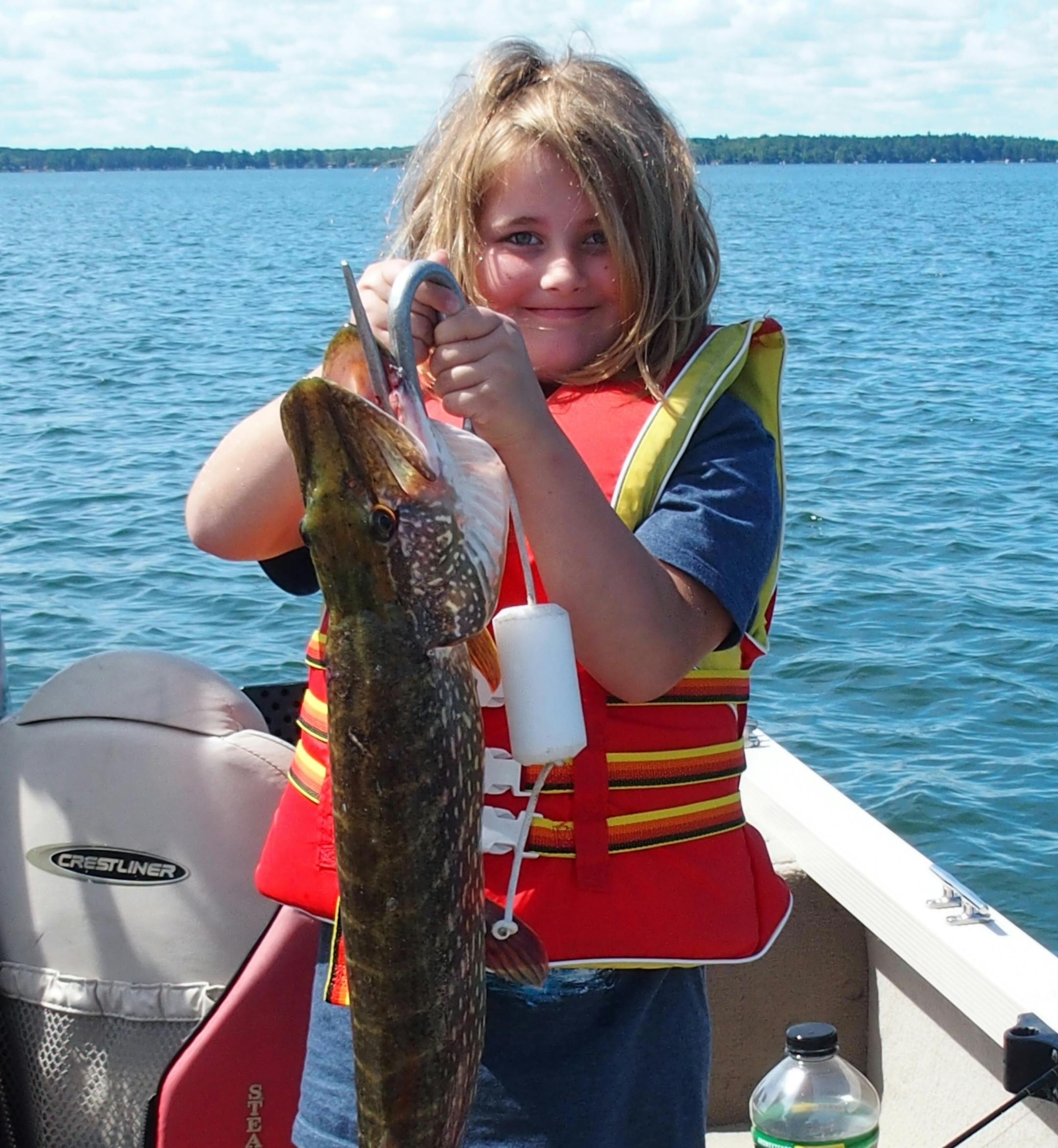 Clara Ekegren Schmid, 9, of St. Paul, caught this 7-pound, 9-ounce northern on Woman Lake near Longville on July 15 while trolling with her grandfather Gene Schmidís secret weapon lure. She won the kidís fishing contest at Broadwater Lodge with this catch.