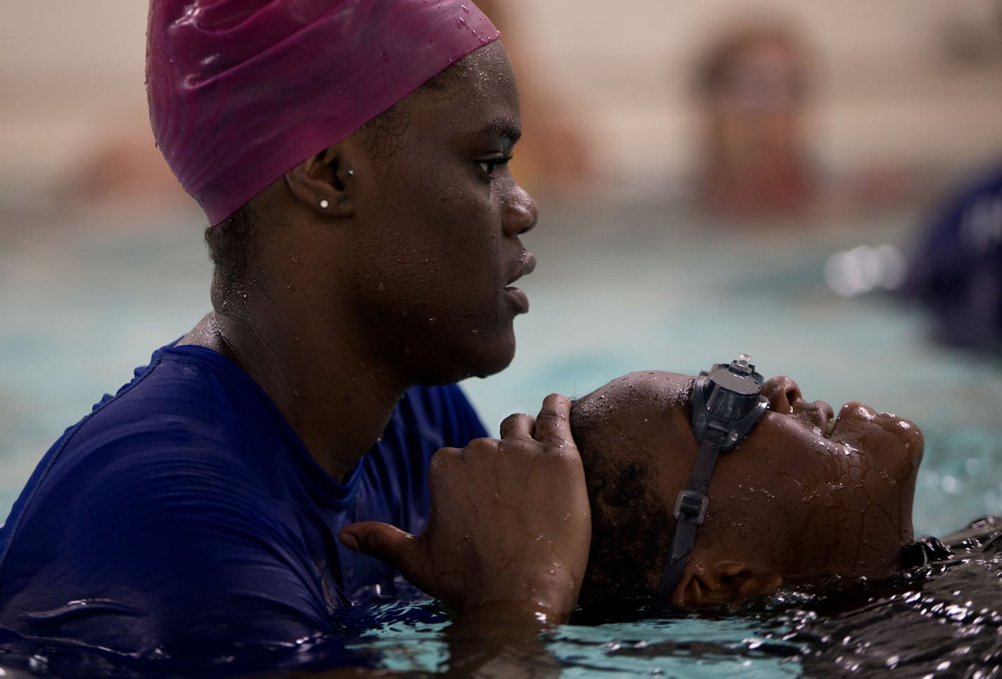 Danyelle Brooks helped guide students at the Blaisdell YMCA in Minneapolis, one of several programs in Minnesota seeking to combat the dangers of swimming.