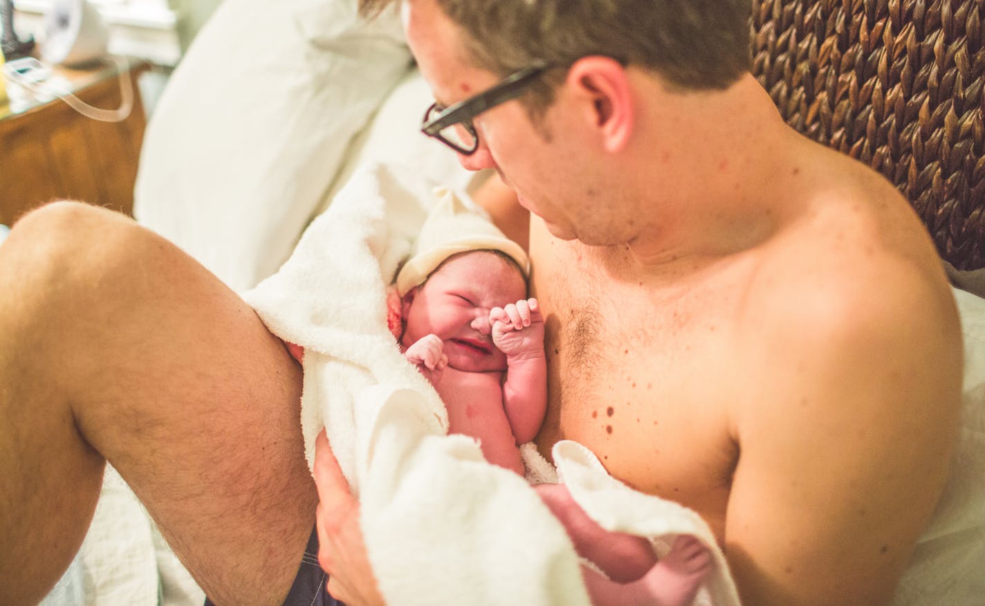 Ben Stockwell after the birth of his daughter Tilja. Some new Dads are dropping the camera and inviting professional photographers into the delivery room to document the intimate moments of birth. Photo by Danica Donnelly.