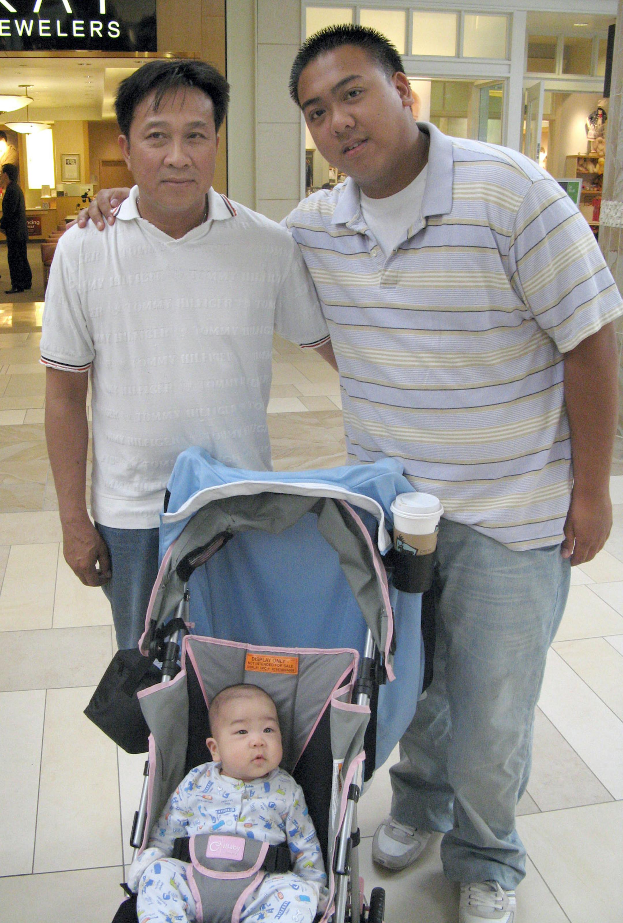 Soutsady Vilay Vanh, 48, with sons Jimmy, 21, and Jame.