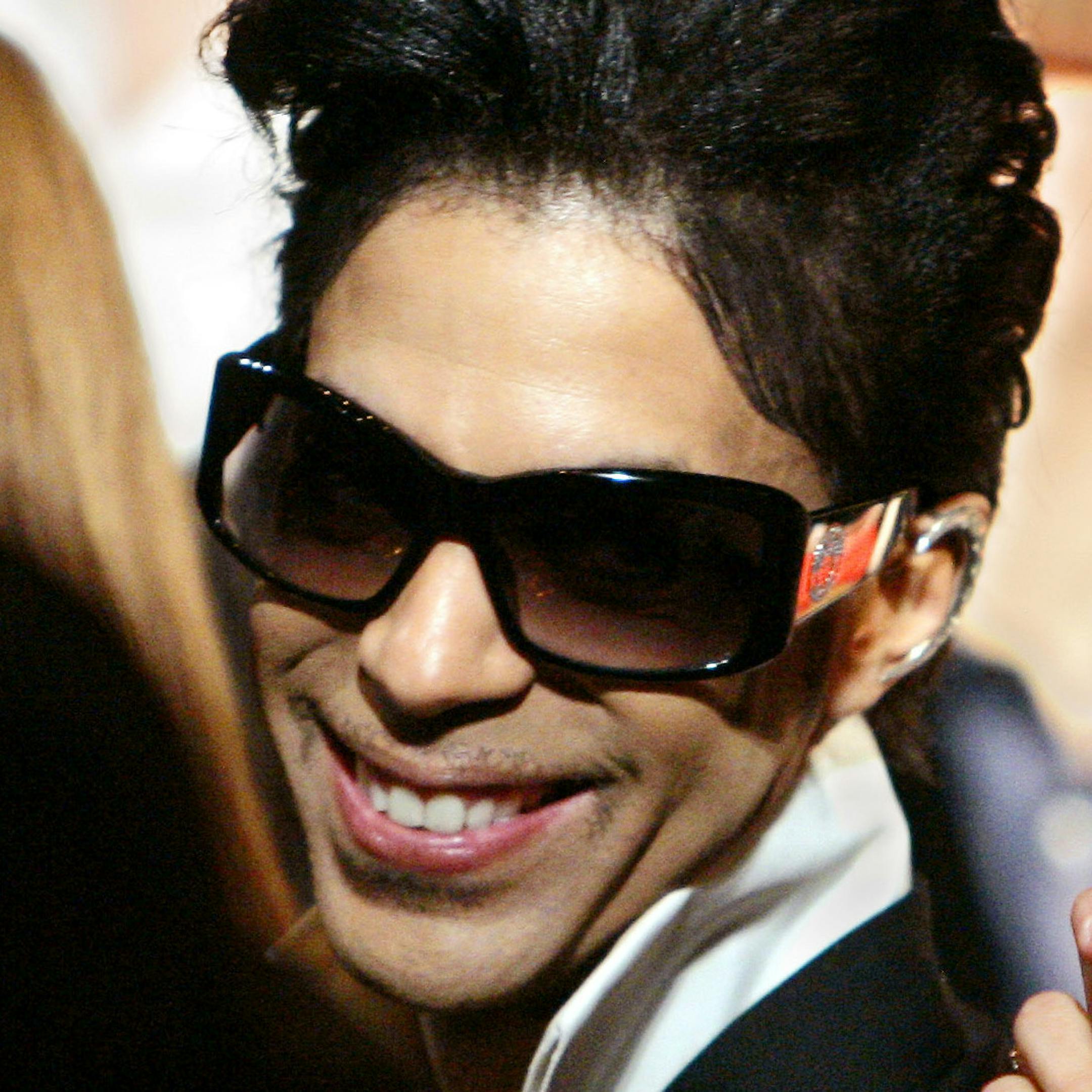 Singer Prince and actress Penelope Cruz sit in the audience, Thursday, Feb. 8, 2007, in Beverly Hills as the City of Beverly Hills and the Rodeo Drive Committee honored Gianni Versace and his sister Donatella Versace for their contributions to the worlds of fashion and entertainment with the Rodeo Drive Walk of Style Award. Versace, founded in 1978 by Gianni Versace, is one of the leading international fashion design houses and a symbol of Italian luxury worldwide. (AP Photo/Mark J. Terrill) ORG