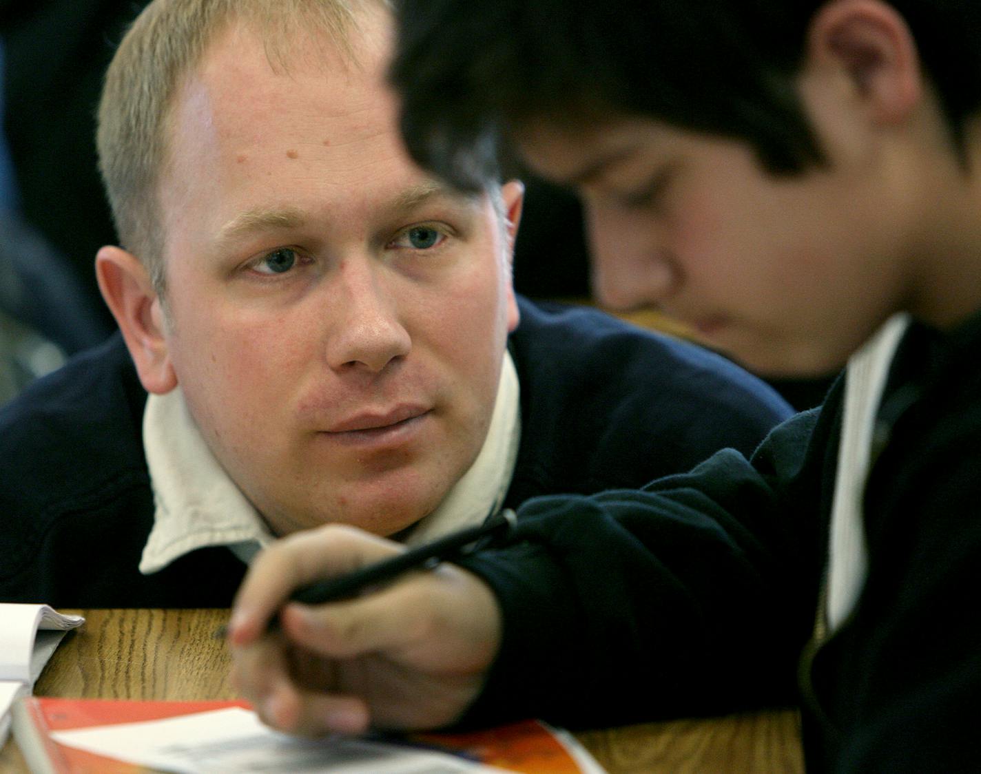 Leif Neilson, an eighth-grade math teacher, worked with a student on solving problems similar to those the students at Nellie Stone Johnson Elementary will encounter on the Minnesota Comprehensive Assessment tests that begin today.