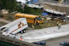 The school bus that was on the I-35W bridge when it collapsed is removed from the south side of bridge in August 2007.