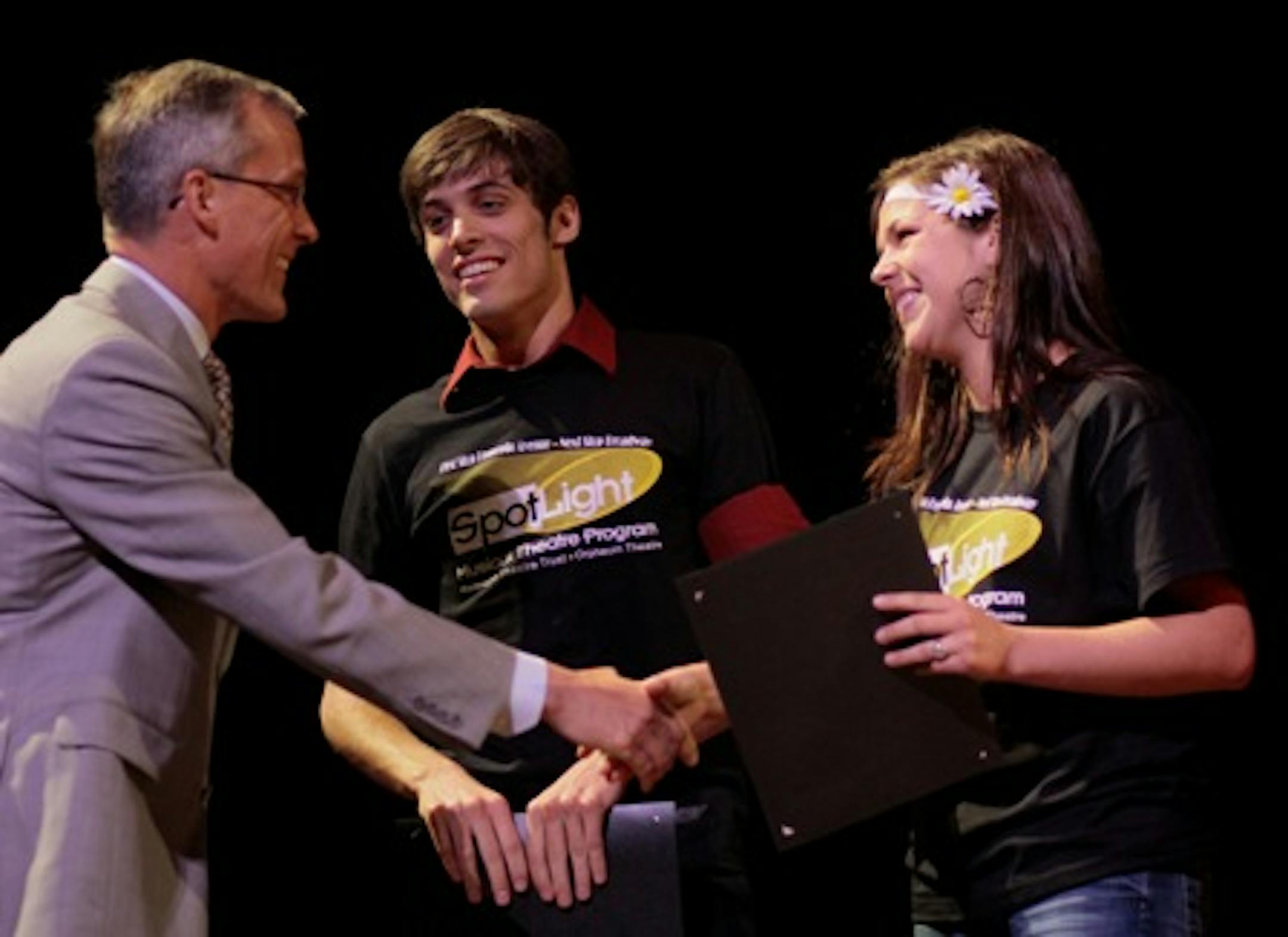 Nathaniel Irvin and Haley Kurr received their SpotLight Awards from Hennepin Theatre Trust President Tom Hoch.