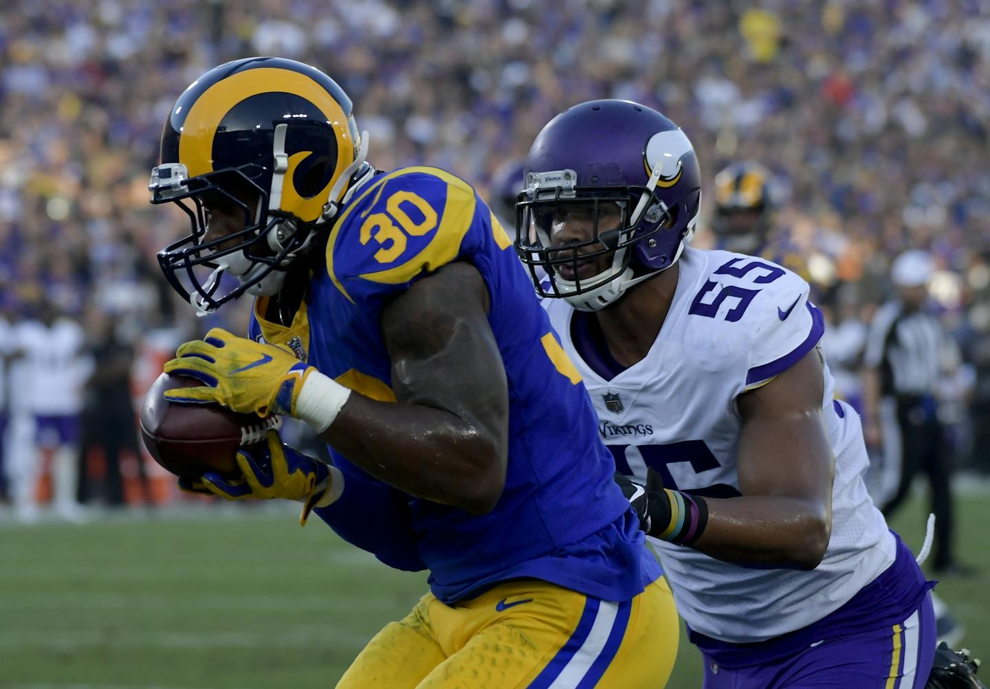 Los Angeles Rams running back Todd Gurley catches a touchdown pass in front of Minnesota Vikings linebacker Anthony Barr during the first half on Thursday.