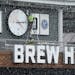 Crews worked to install the clock above the the Brew Hall Friday at Allianz Field amid heavy snow flurries ahead of Saturday's home opener. ] ANTHONY 