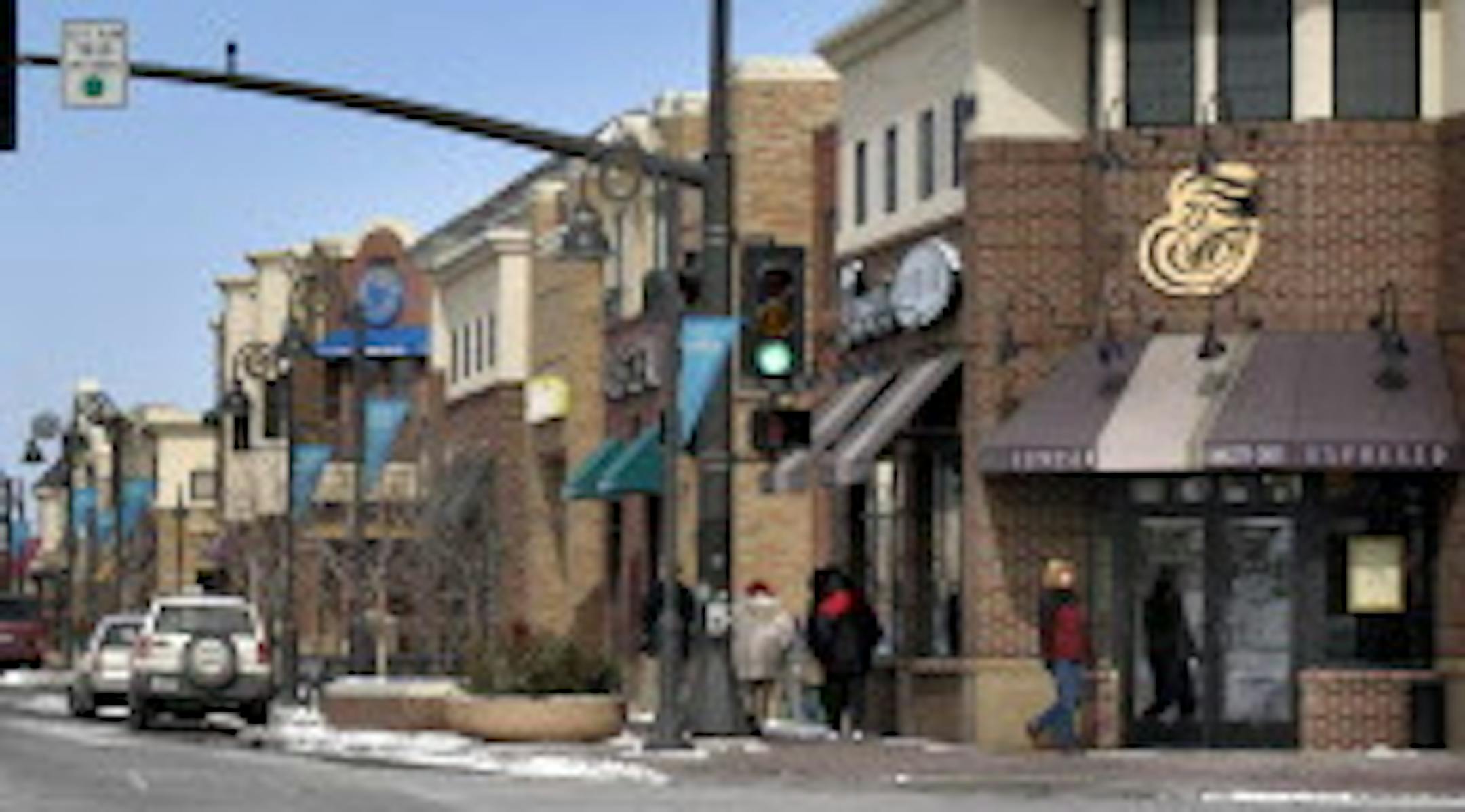 Main Street is lined with two-story storefront buildings.
GENERAL INFORMATION: MAPLE GROVE, MN. 3/4/2003: This is a profile of the housing market in Maple Grove, which is in the process of rapid expansion. More than a thousand new units are planned at the city's town center, known as Arbor Lakes. One of the newest projects in that development is an affordable rental project owned by CommonBond Communities. Marie Weaver is one of the residents.