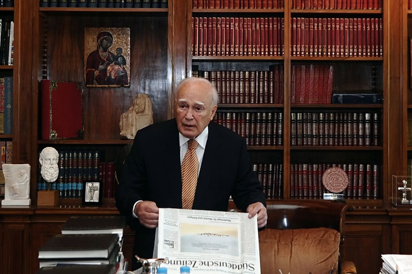 Greek President Karolos Papoulias looks on before his meeting with Greek Socialist leader Evangelos Venizelos in Athens, Saturday, May 12, 2012. Greek President Karolos Papoulias has called the leaders of Greece's political parties to meetings on Sunday, in a last-ditch effort to broker a deal for a coalition government.