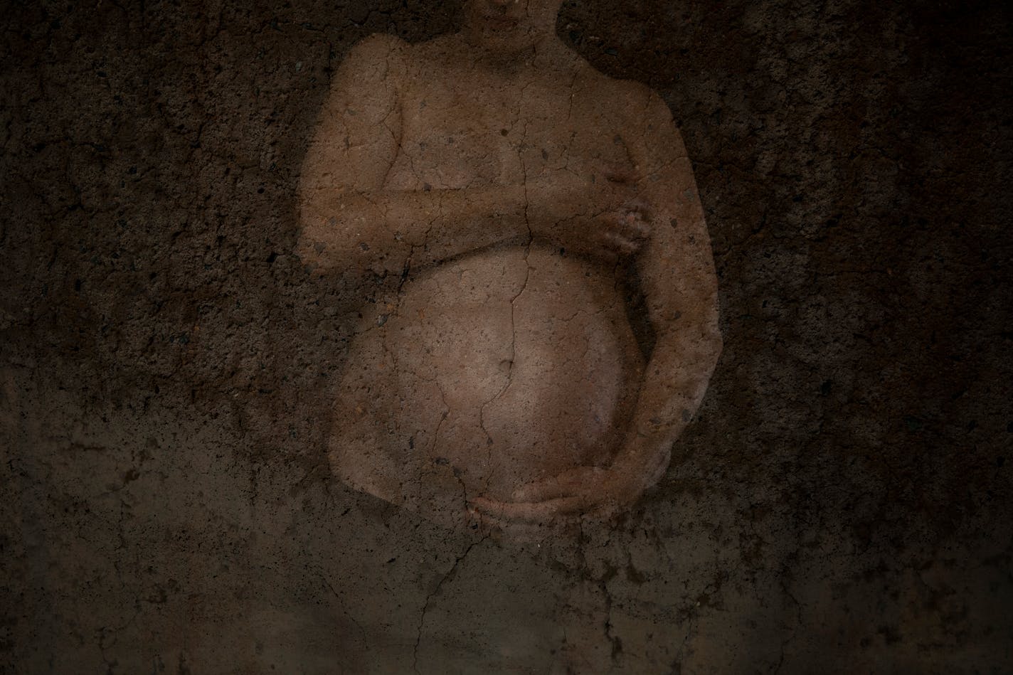 FILE — In a double-exposure image, a pregnant woman, in New York, Nov. 2018. The interpretation of pregnancy as a process in which a woman's body isn't just occupied but is taken over — put to use — has an ideological tilt, but it rests on clear biological realities, Ross Douthat writes. (Damon Winter/The New York Times)