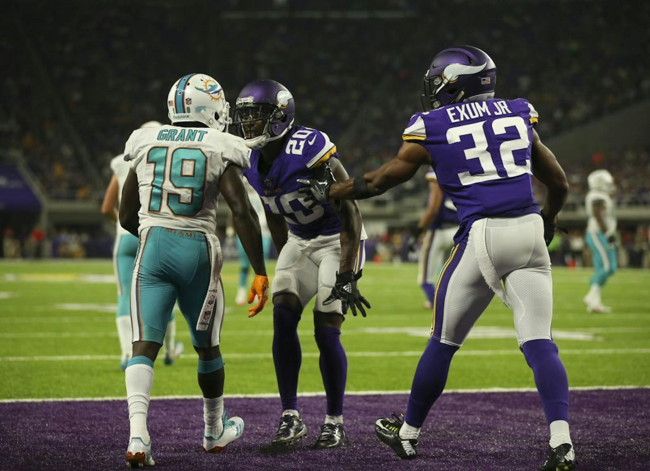 Minnesota Vikings cornerback Mackensie Alexander (20) was penalized for taunting Miami Dolphins wide receiver Jakeem Grant (19) after he successfully defended him the in the end zone in the second quarter.