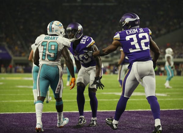 Minnesota Vikings cornerback Mackensie Alexander (20) was penalized for taunting Miami Dolphins wide receiver Jakeem Grant (19) after he successfully 