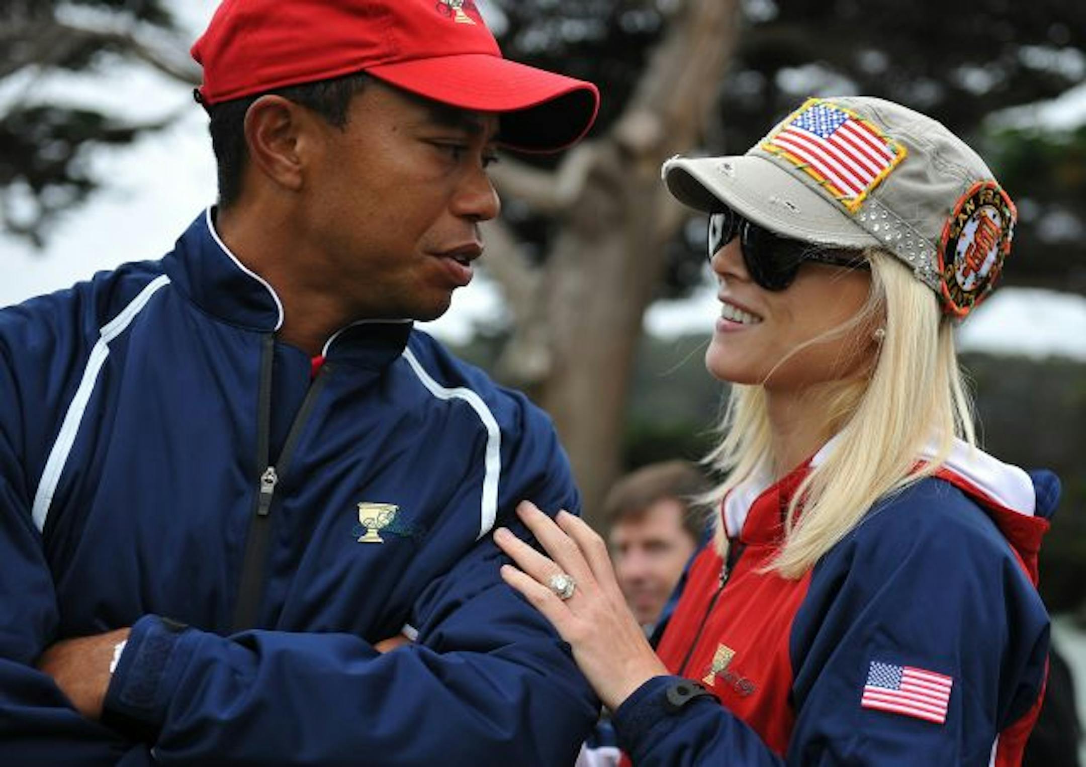 (FILES)Elin Nordegren, wife of US team member Tiger Woods,smiles at the Presidents Cup golf competiton in this October 10, 2009 file photo at Harding Park Golf course in San Francisco, California. Tiger Woods's Swedish-born wife Elin Nordegren wants a divorce because of the golfing great's extramarital flings, People magazine reported December 16, 2009. "She plans to leave Tiger," one unidentified source "close to the golfer's wife" was quoted as saying. The former model and mother of two has me