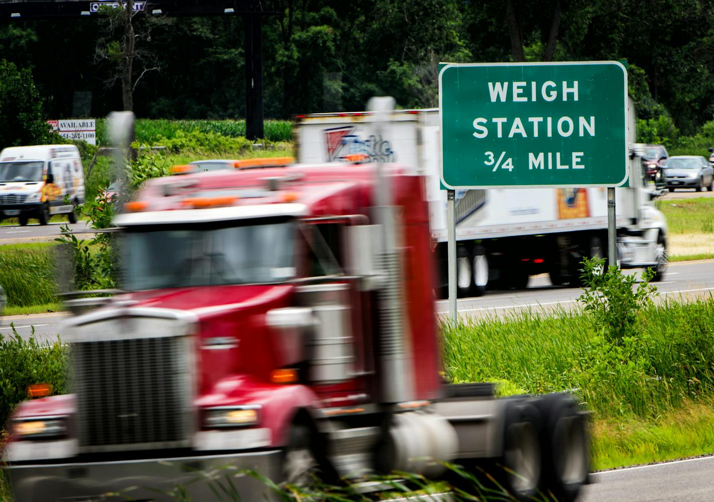 New technology recently rolled out at some rest stops in Minnesota and other Midwestern states aims to help truck drivers find parking. In this file photo, trucks travel near the rarely used Forest Lake weigh station along I-35 north of the Twin Cities.