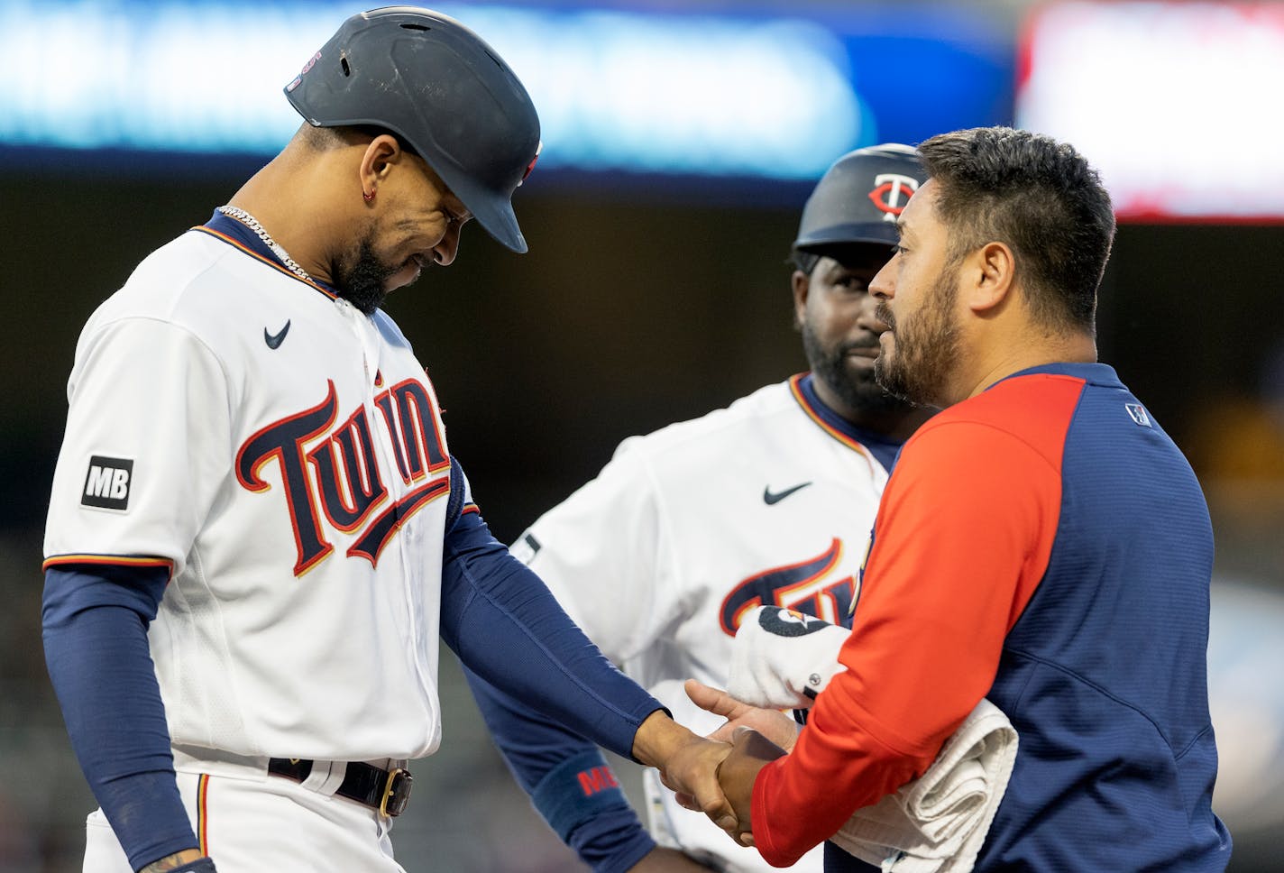 Minnesota Twins centerfielder Byron Buxton (25) was looked at by trainer Michael Salazar after being hit by a pitch in the fourth inning.