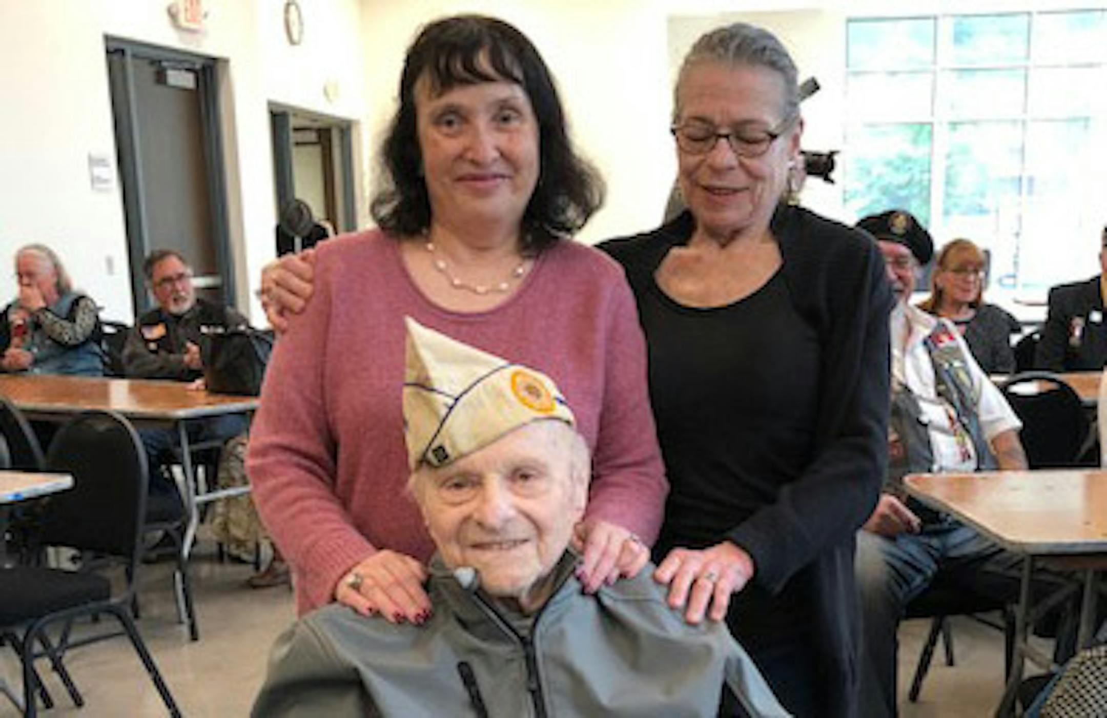 Samuel Nilva at his 100th birthday party in 2019 with daughters Barbara Nevin and Alexis Diker.