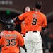 Kevin Gausman, rear, celebrated with Brandon Belt (9) after hitting a sacrifice fly that scored Brandon Crawford (35) during a Giants victory in Septe