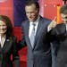Michele Bachmann had few chances to speak early in Wednesday's debate, as Mitt Romney, center, and Rick Perry dominated the attention.