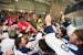 The Blaine Bengals celebrate with the student section after defeating Centennial 8-1 in the Class 2A Section 5 boy's hockey final at Aldrich Arena] (A