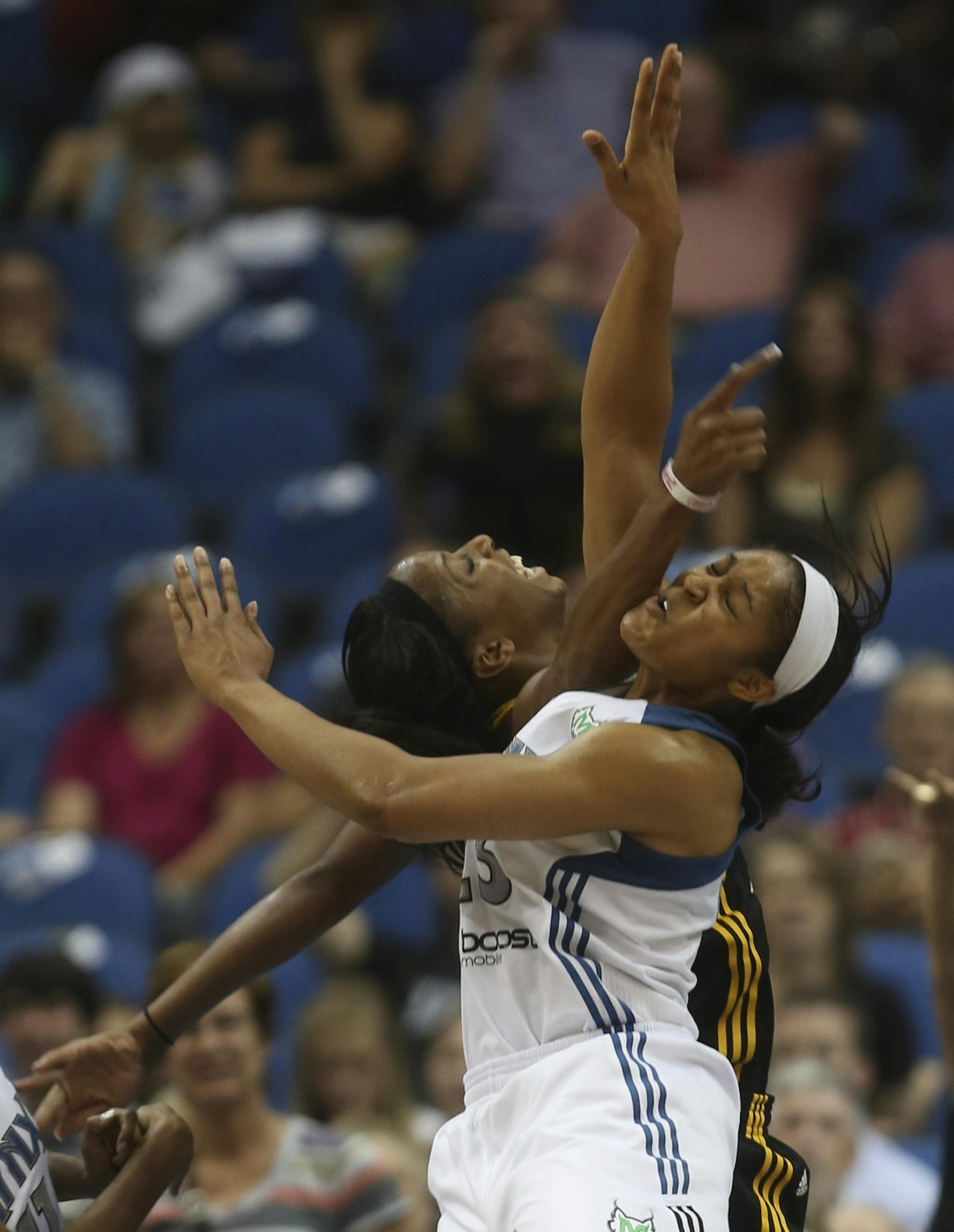 Lynx Maya Moore clashed with Shock Glory Johnson going after a rebound during second half action at the Target Center in Minneapolis, Min., Friday August 31, 2012. Lynx won over the Shock 92-83.