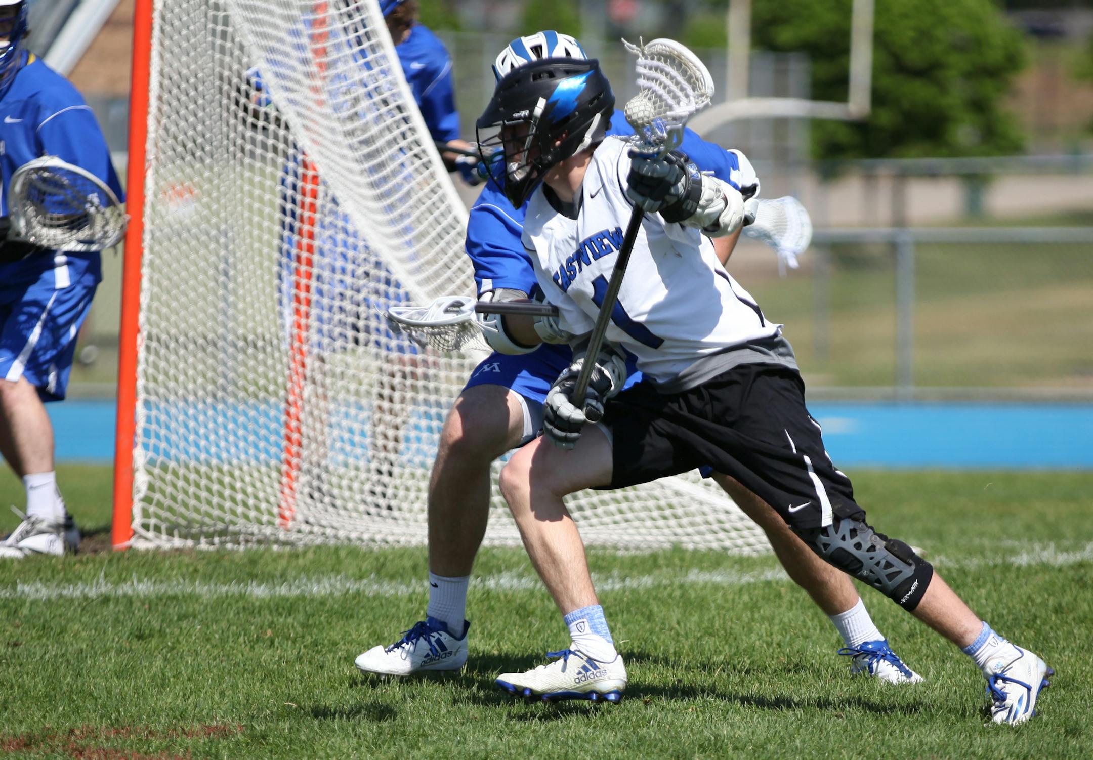 Eastview Lightning attacker Noah Lindner (1) looked to pass the ball during a lacrosse game against Minnetonka High School Saturday. ] XAVIER WANG • xavier.wang@startribune.com Game action from a High School Boys' lacrosse game between Eastview and Minnetonka on Saturday May 13, 2017 at Eastview High School in Apple Valley