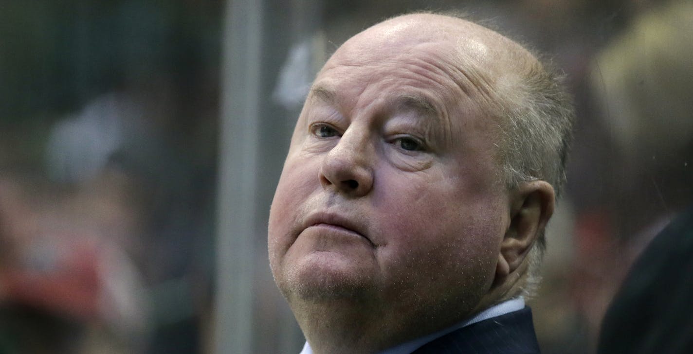 Minnesota Wild head coach Bruce Boudreau watches play against the Dallas Stars in the first period of an NHL hockey game in Dallas, Saturday Jan. 14, 2017. (AP Photo/LM Otero)