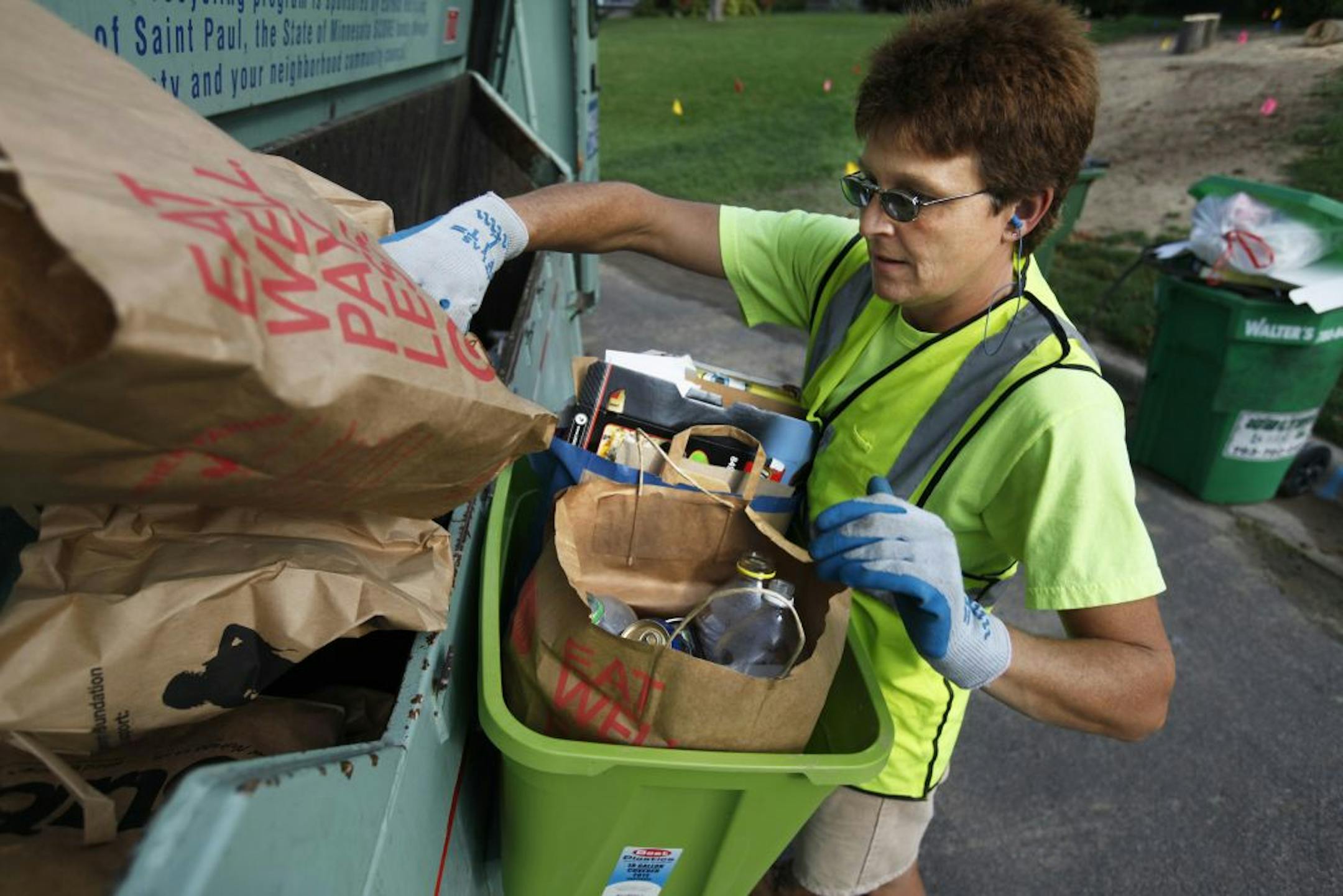 Connie Kight works at fast pace to recycle the material from the 900 or so homes which are on her beat today. The materials in Roseville are separated into two bins: one for paper products and the other for glass and plastic. Kight says she enjoys doing her part for the environment.